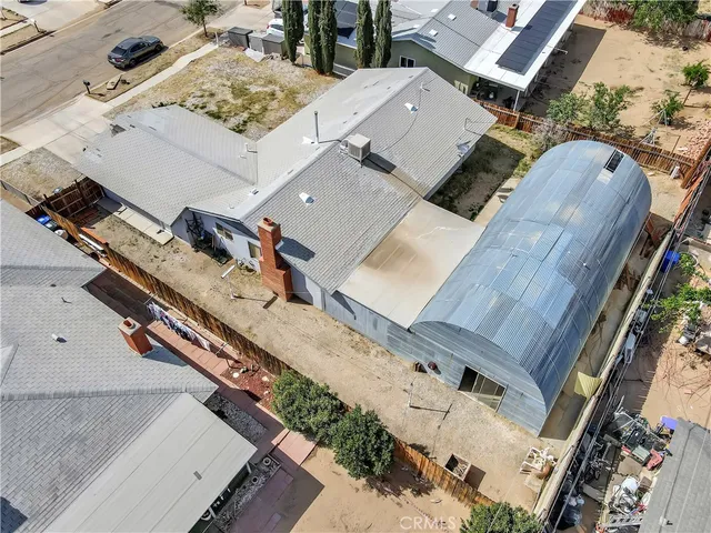 an aerial view of a residential houses with outdoor space