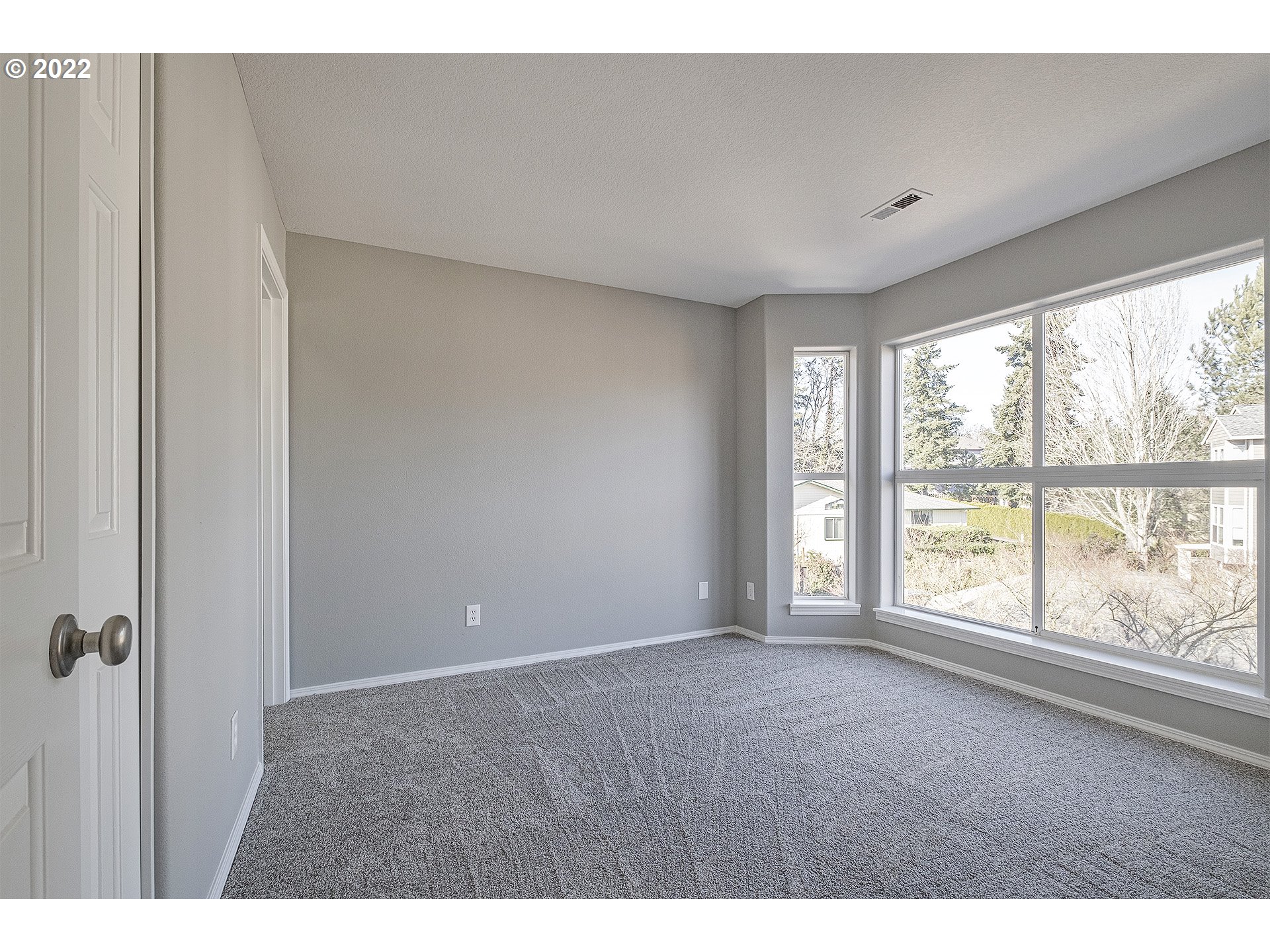 15718 Southwest Flagstone Drive Beaverton, OR 97007 - Photo 26 of 32 a view of an empty room with a window