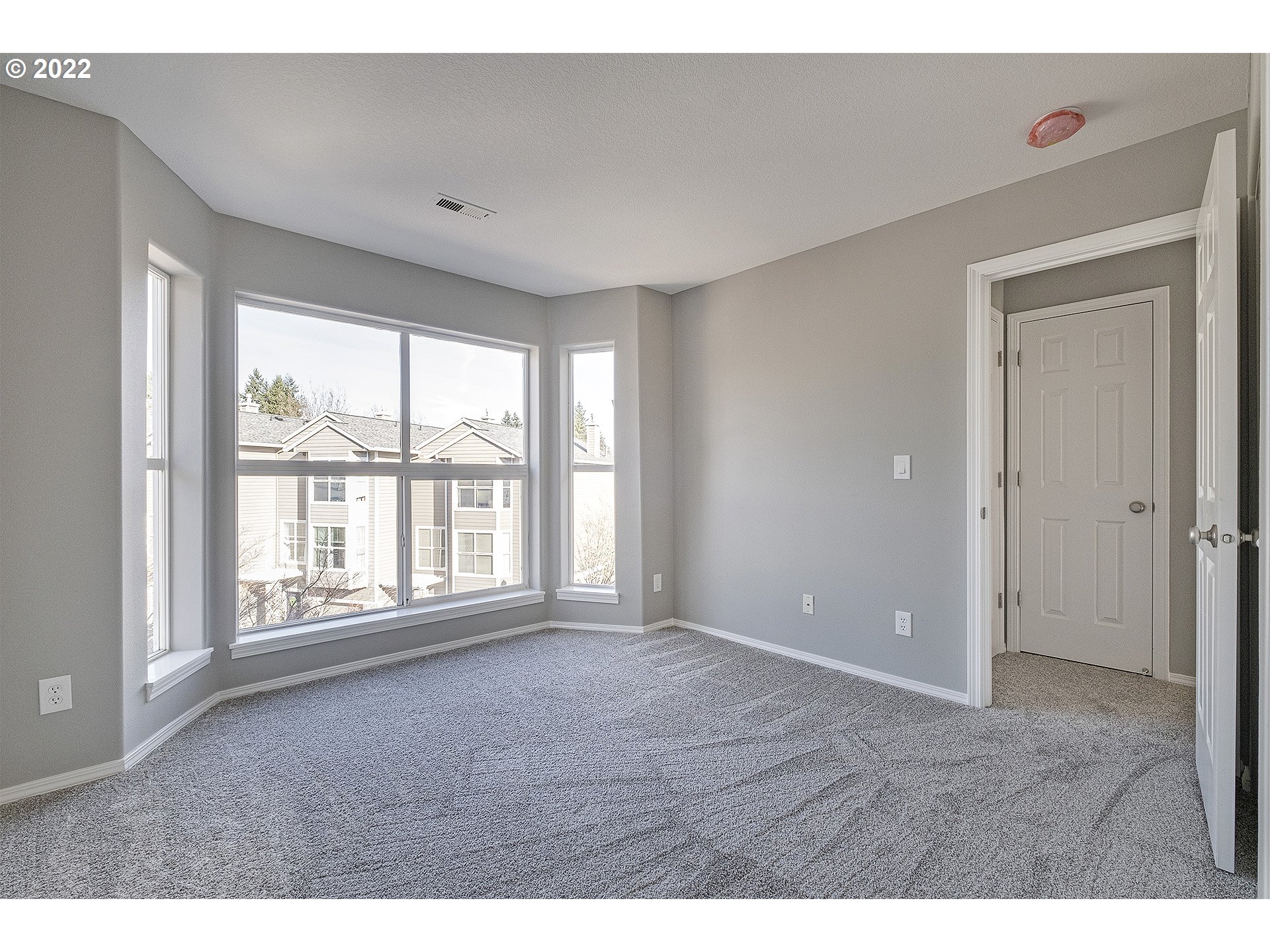 15718 Southwest Flagstone Drive Beaverton, OR 97007 - Photo 27 of 32 a view of an empty room with a window