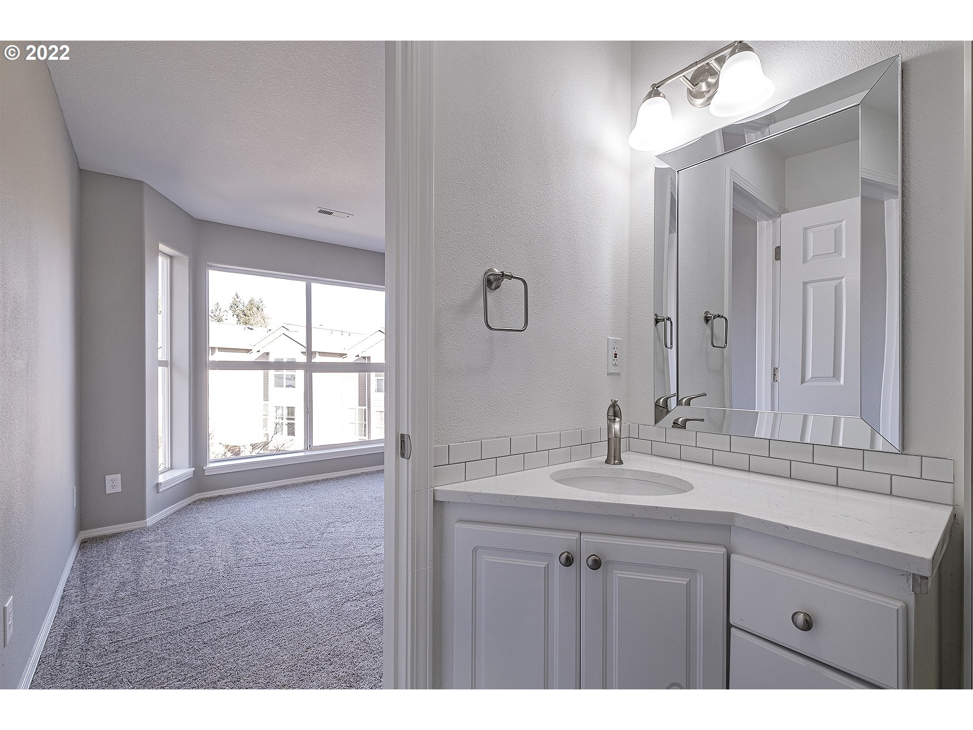 15718 Southwest Flagstone Drive Beaverton, OR 97007 - Photo 29 of 32 a bathroom with a sink and a mirror