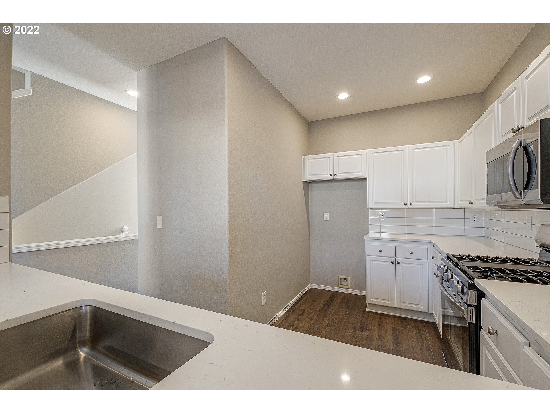 15718 Southwest Flagstone Drive Beaverton, OR 97007 - Photo 8 of 32 a kitchen with a sink cabinets and appliances