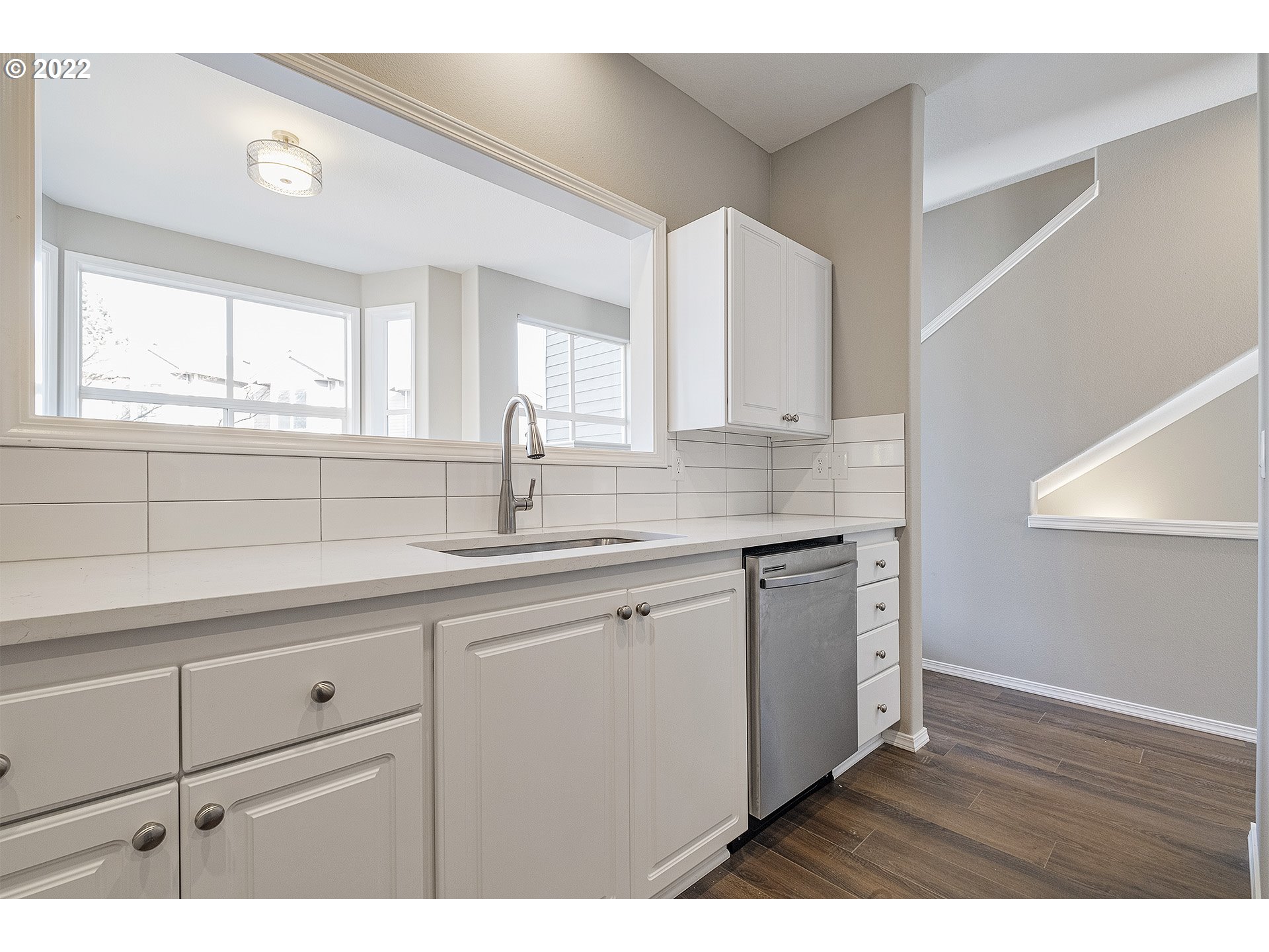 15718 Southwest Flagstone Drive Beaverton, OR 97007 - Photo 10 of 32 a kitchen with sink cabinets and window
