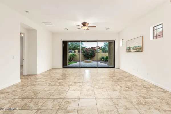 a view of a kitchen with a sink and a refrigerator