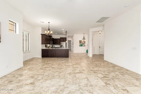 a kitchen with stainless steel appliances granite countertop a stove top oven a sink dishwasher and a microwave oven on the blue kitchen countertops
