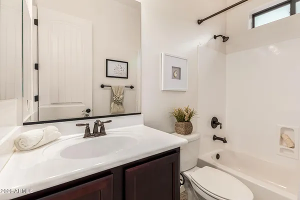 a view of a backyard with plants and a patio