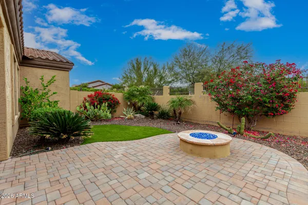 a living room with furniture and large windows