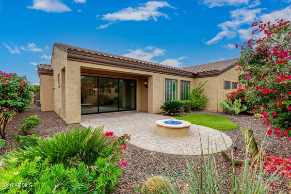 a room with gym equipment and windows