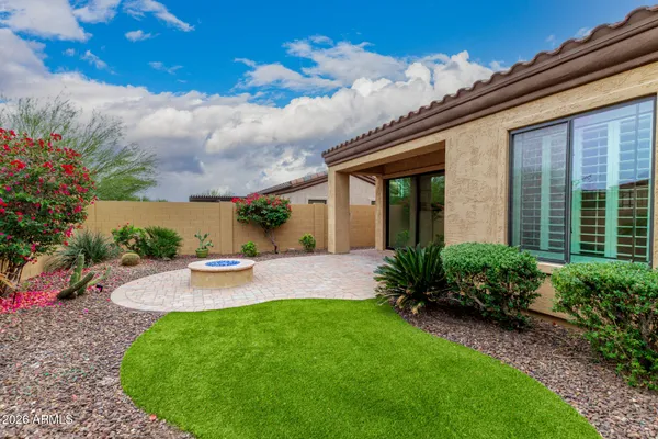 a living room with furniture gym equipment and a large window