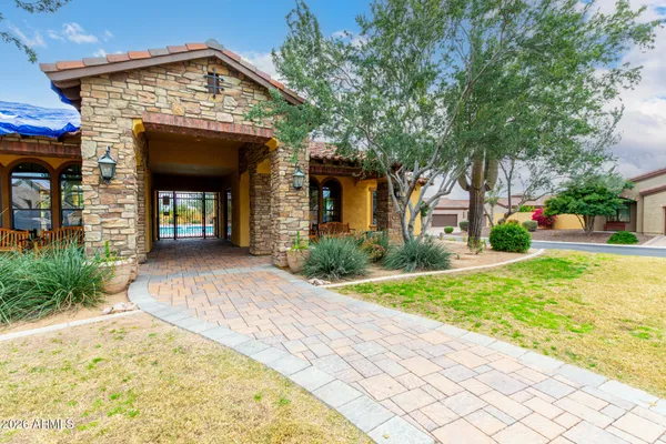a living room with furniture and large windows