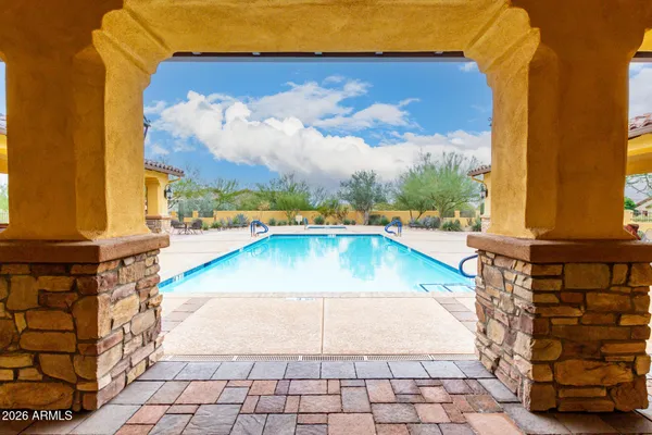a room with gym equipment and windows