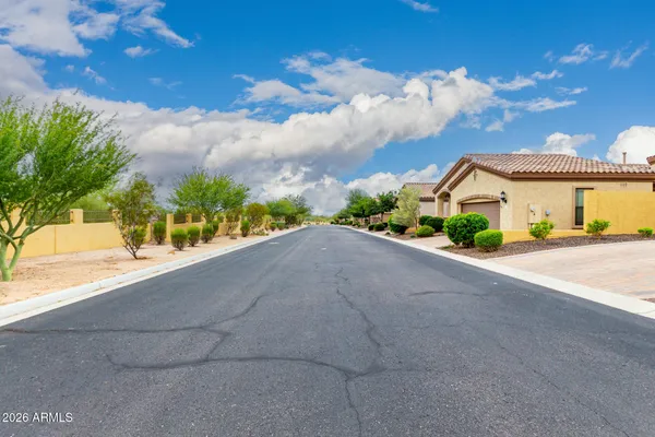 a living room with furniture gym equipment and a large window