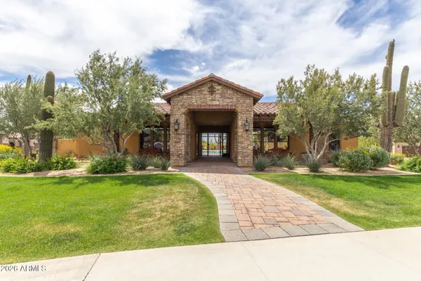 an aerial view of a house with a lake view