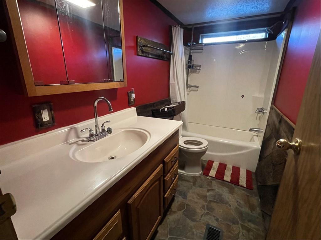 554 Waynesburg Road Washington, PA 15301 - Photo 22 of 35 a bathroom with a sink a toilet a mirror and vanity