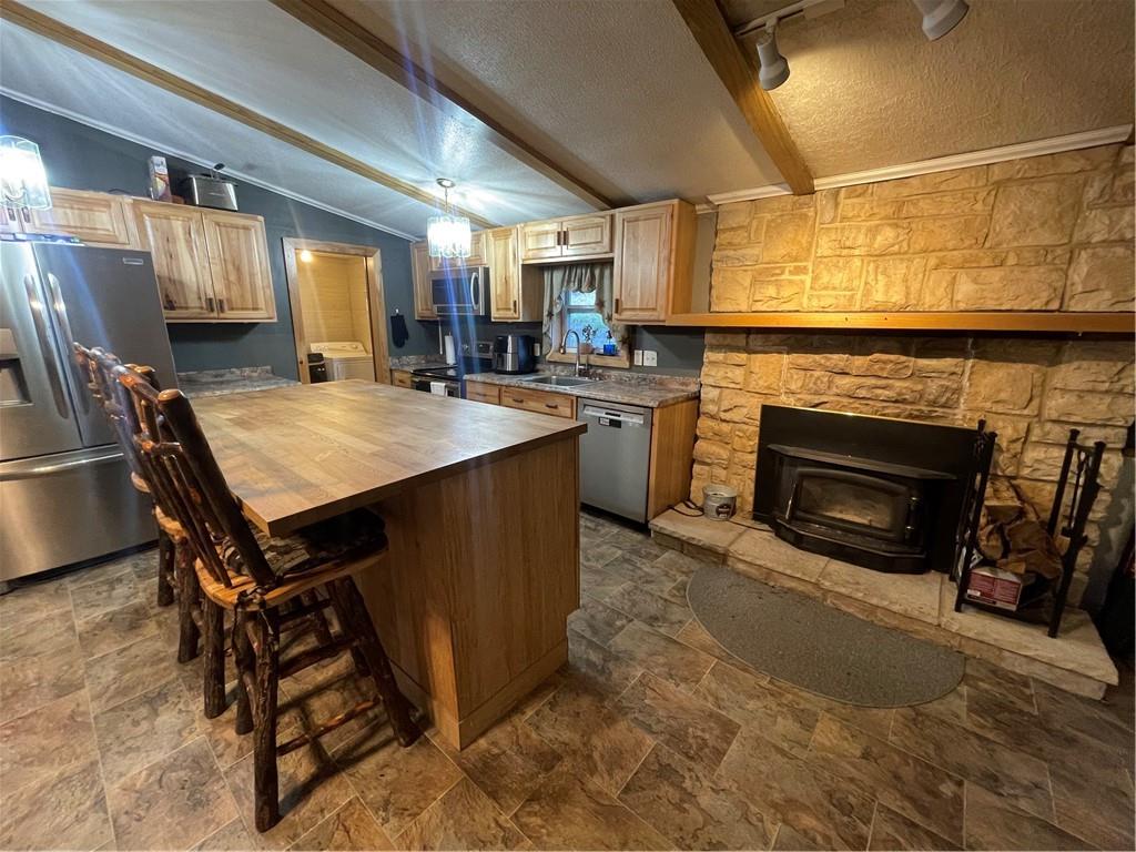 554 Waynesburg Road Washington, PA 15301 - Photo 8 of 35 a open kitchen with a sink a stove and a refrigerator