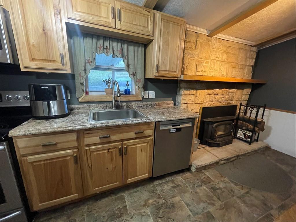 554 Waynesburg Road Washington, PA 15301 - Photo 9 of 35 a kitchen with granite countertop a stove a sink and a microwave