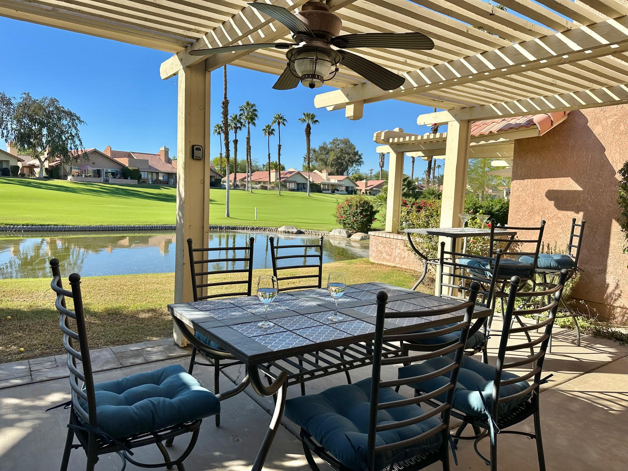 a view of a patio with a table chairs and a table