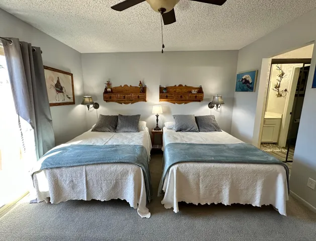 a bedroom with bed and window