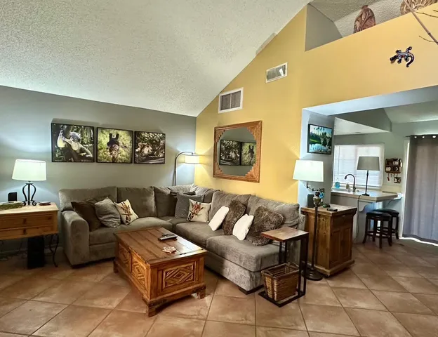 a living room with furniture and a window