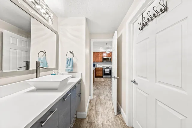 a bathroom with a double vanity sink and mirror