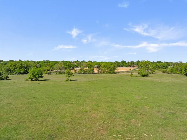 a view of a lake with houses in the background
