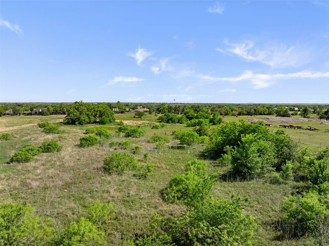 a view of a lake with a yard