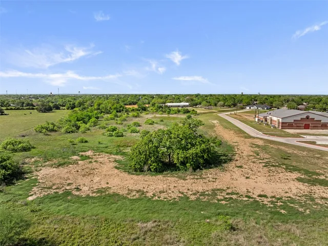 a view of a field with an ocean