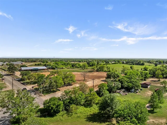 a view of a lake with houses in the back