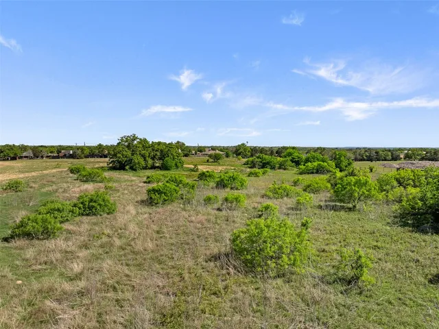 a view of a lake with houses in the back