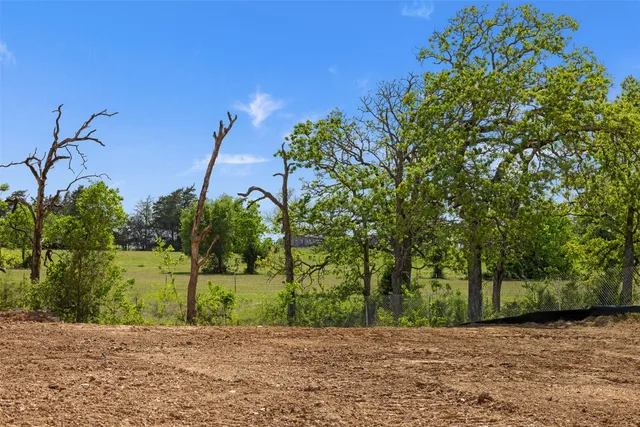 a view of a street with a building in the background