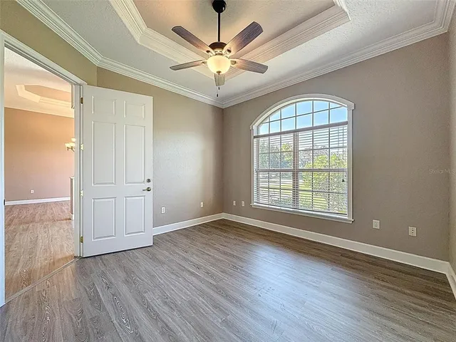 a kitchen with wooden cabinets and a stove top oven