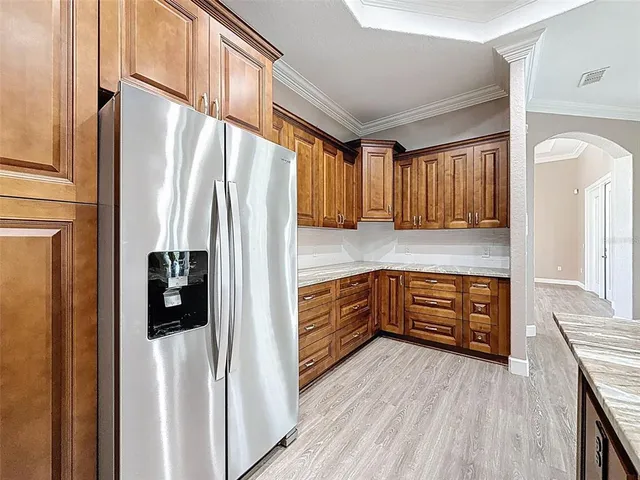 a view of a room with a chandelier fan and window
