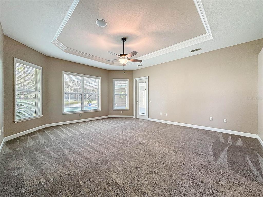 11235 Warm Wind Way Weeki Wachee, FL 34613 - Photo 35 of 93 a view of an empty room with a window