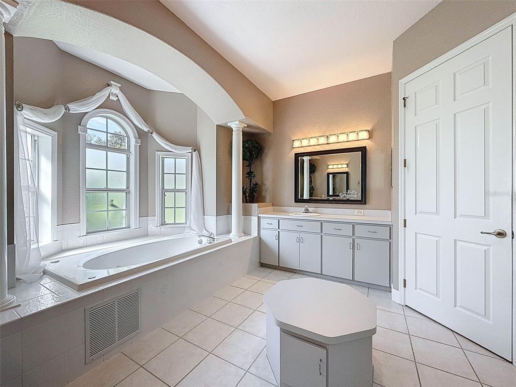 11235 Warm Wind Way Weeki Wachee, FL 34613 - Photo 41 of 93 a large white kitchen with cabinets a sink and a window