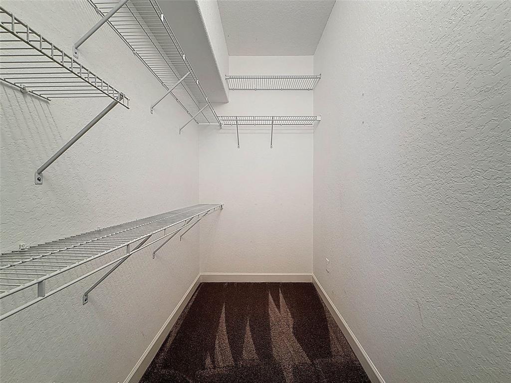 11235 Warm Wind Way Weeki Wachee, FL 34613 - Photo 45 of 93 a view of a room with racks on the wall