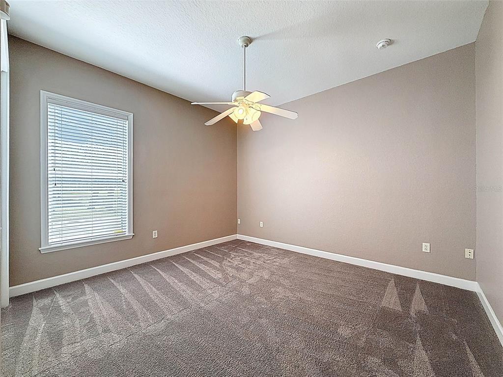 11235 Warm Wind Way Weeki Wachee, FL 34613 - Photo 46 of 93 a view of an empty room with a window
