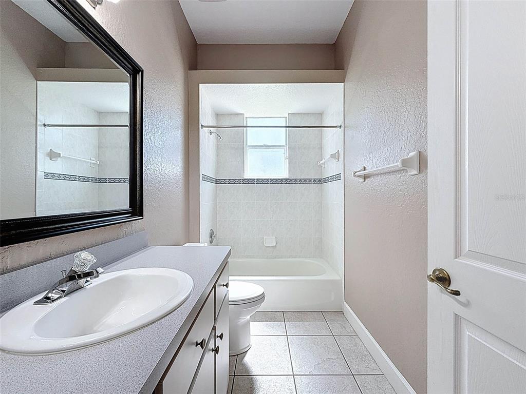 11235 Warm Wind Way Weeki Wachee, FL 34613 - Photo 50 of 93 a bathroom with a sink toilet and shower