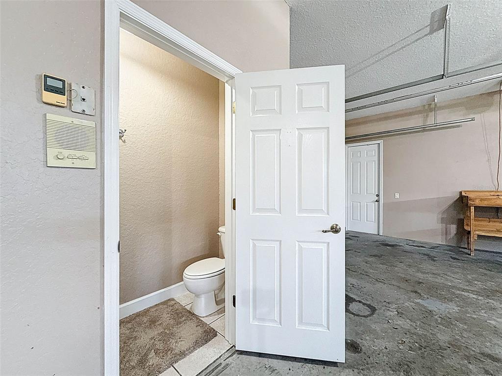 11235 Warm Wind Way Weeki Wachee, FL 34613 - Photo 76 of 93 a view of a bathroom with a sink and a toilet