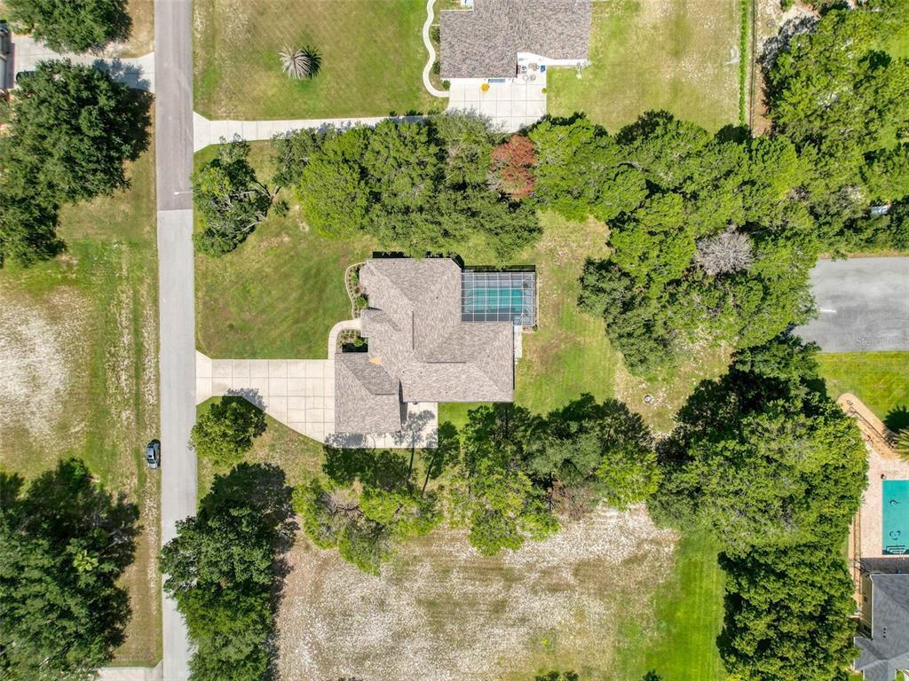 11235 Warm Wind Way Weeki Wachee, FL 34613 - Photo 80 of 93 an aerial view of a house with a yard
