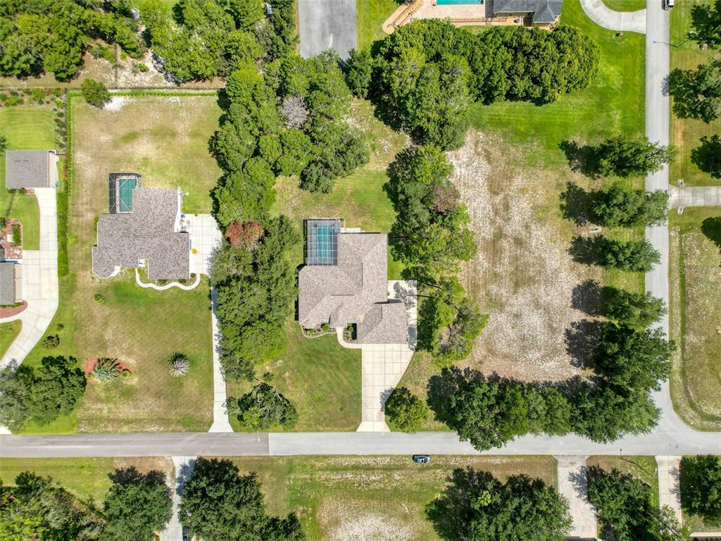 11235 Warm Wind Way Weeki Wachee, FL 34613 - Photo 82 of 93 an aerial view of a house with a yard