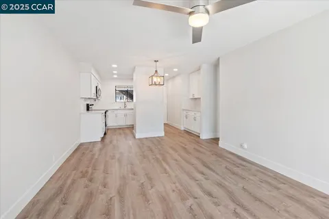 a kitchen with stainless steel appliances a sink stove and cabinets