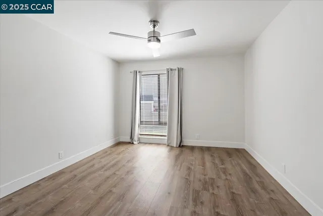 a bathroom with a sink vanity and a toilet