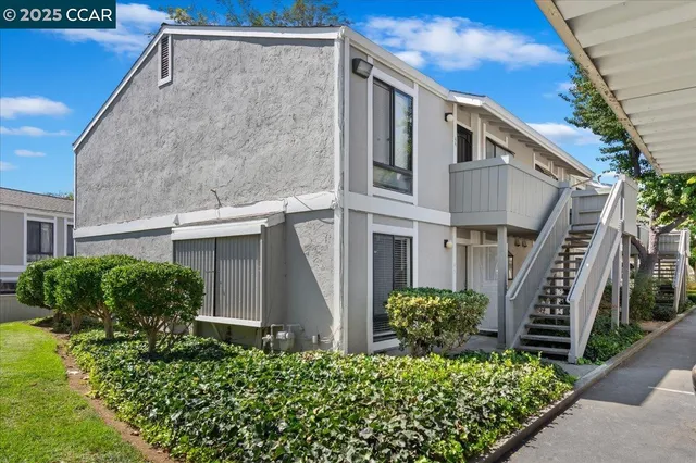 a view of a house with a flower garden