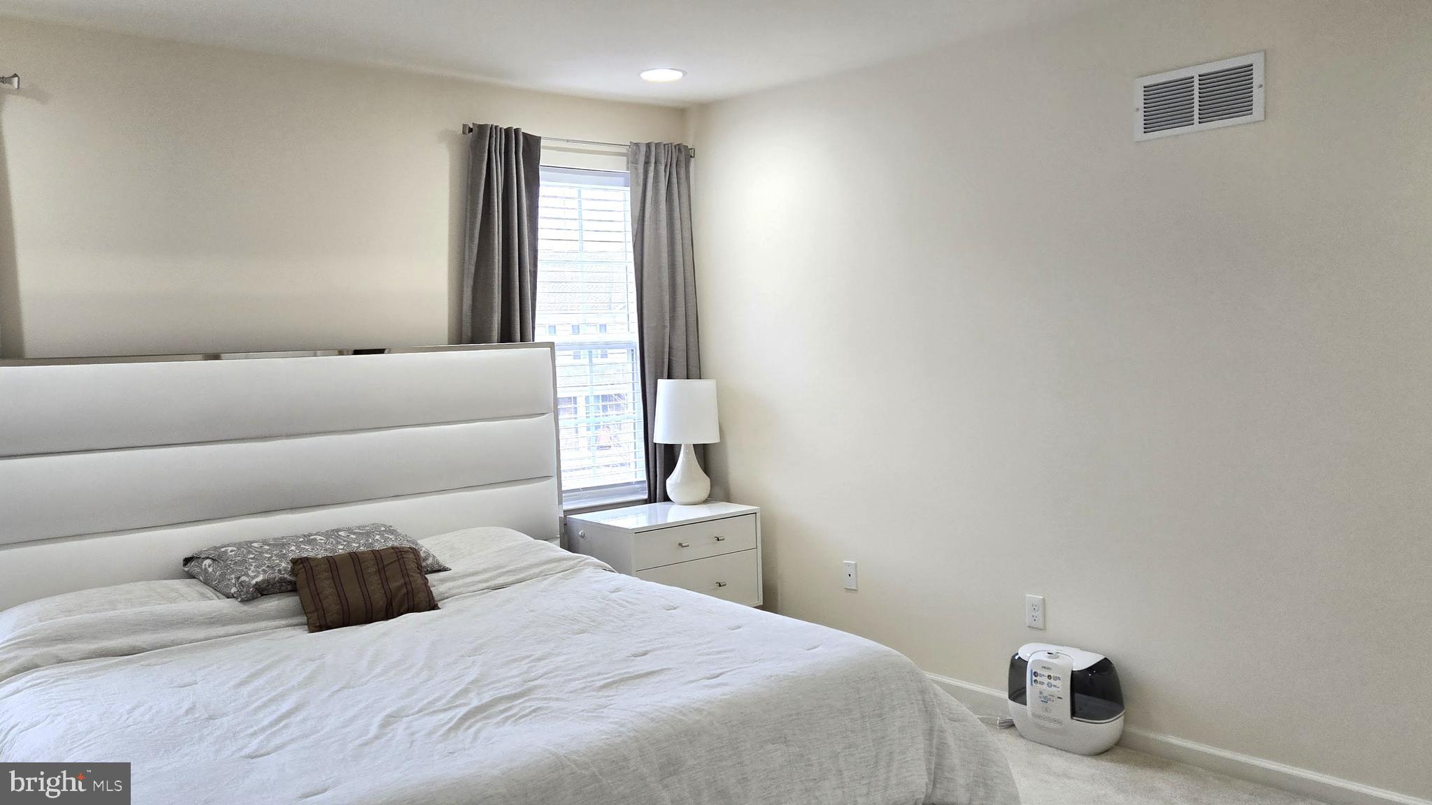 602 Rigel Way Bear, DE 19701 - Photo 16 of 28 a bedroom with a bed and a window