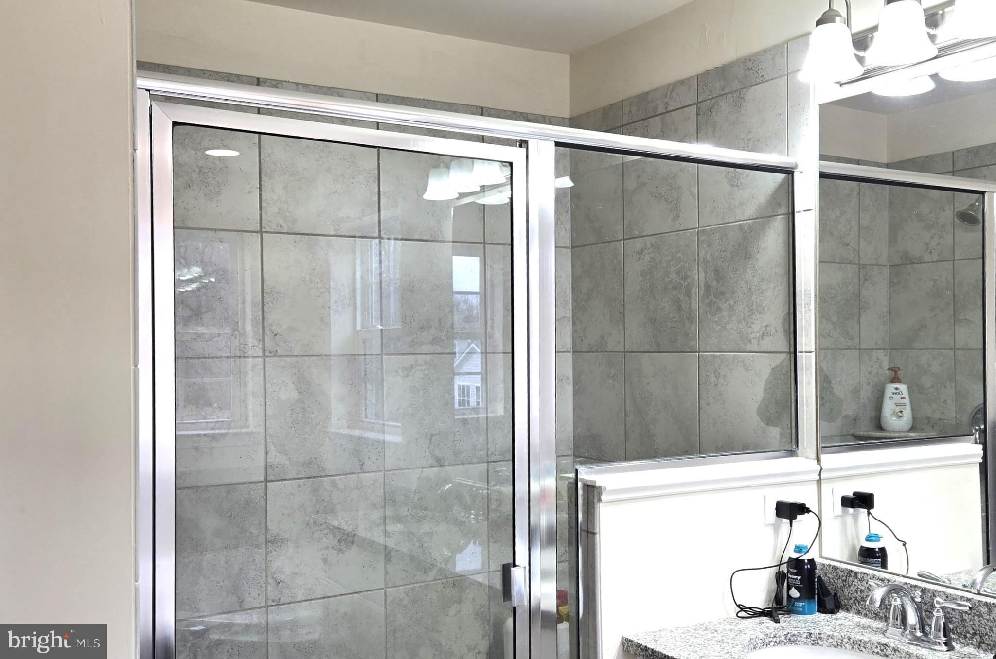 602 Rigel Way Bear, DE 19701 - Photo 17 of 28 a bathroom with a bathtub and a shower