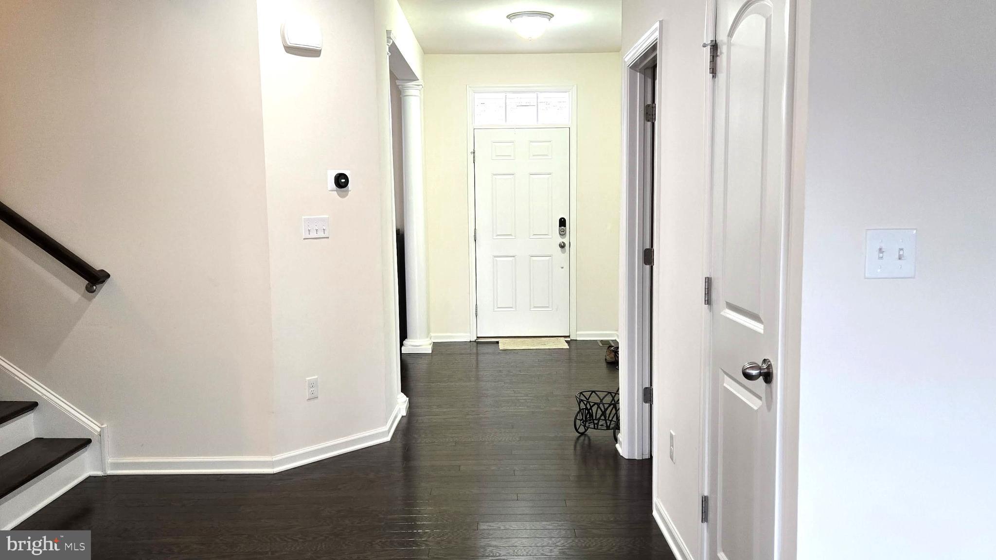 602 Rigel Way Bear, DE 19701 - Photo 5 of 28 a view of a hallway with wooden floor
