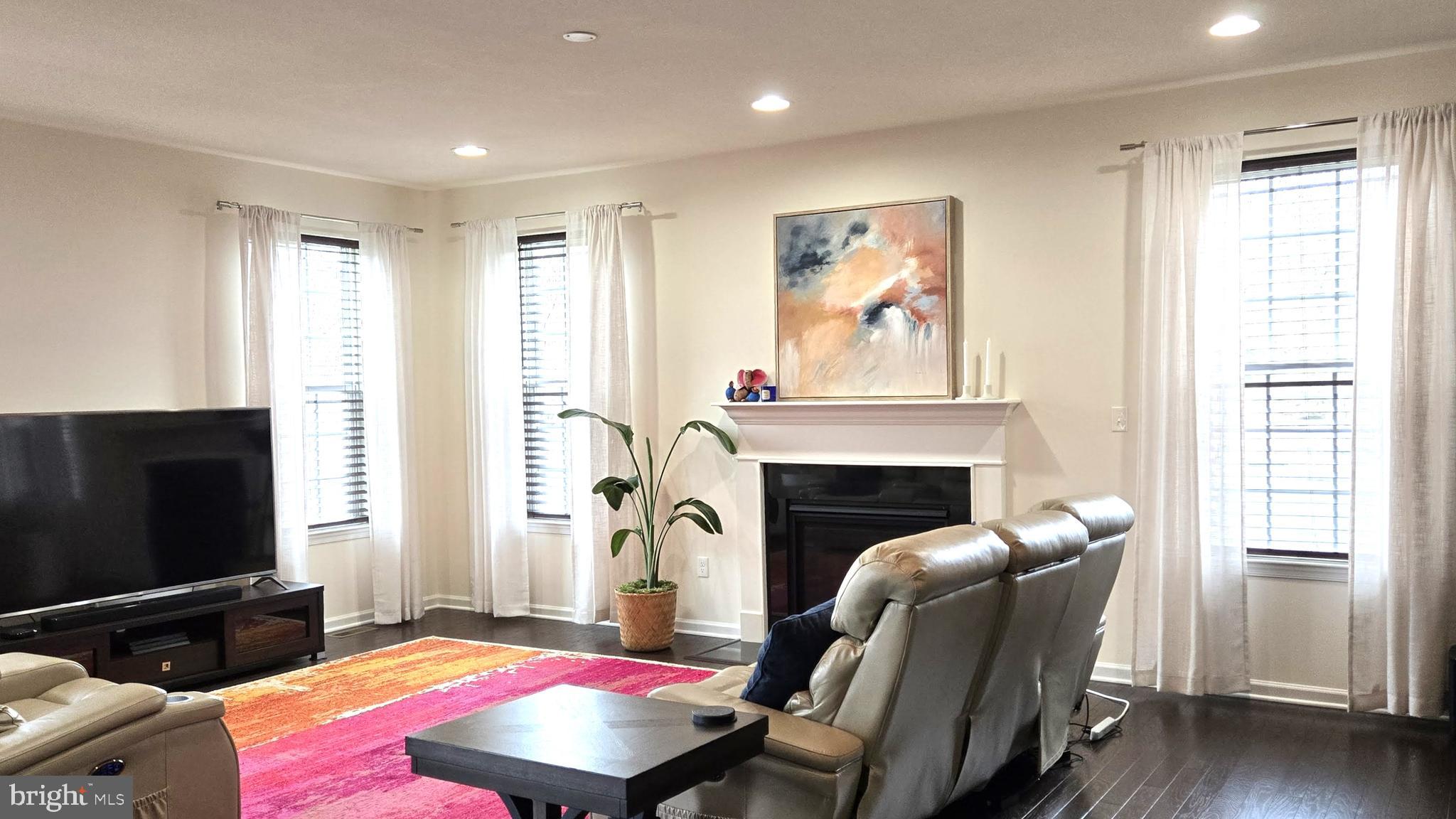 602 Rigel Way Bear, DE 19701 - Photo 8 of 28 a bedroom with furniture and a fireplace