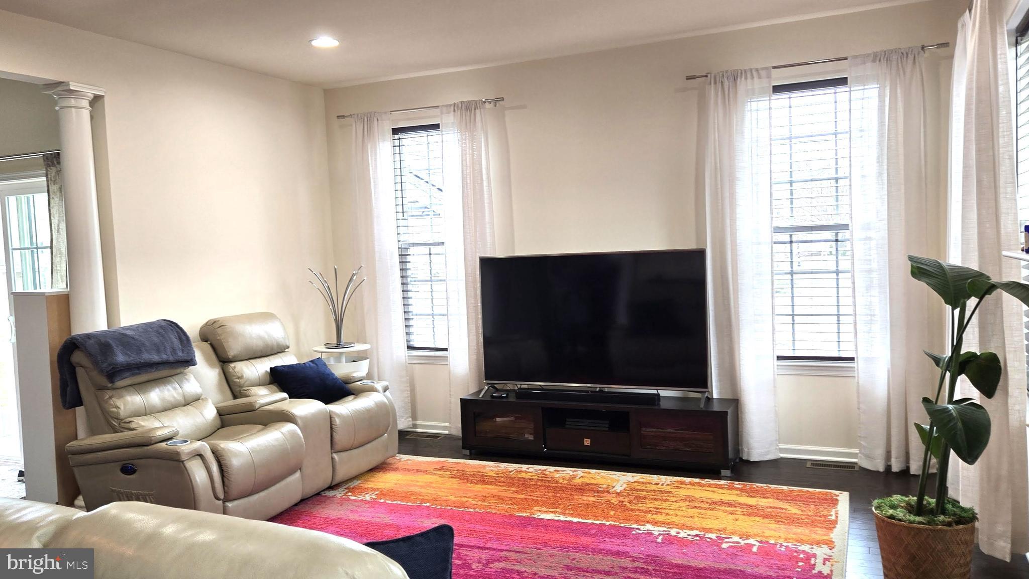 602 Rigel Way Bear, DE 19701 - Photo 9 of 28 a living room with furniture and a flat screen tv