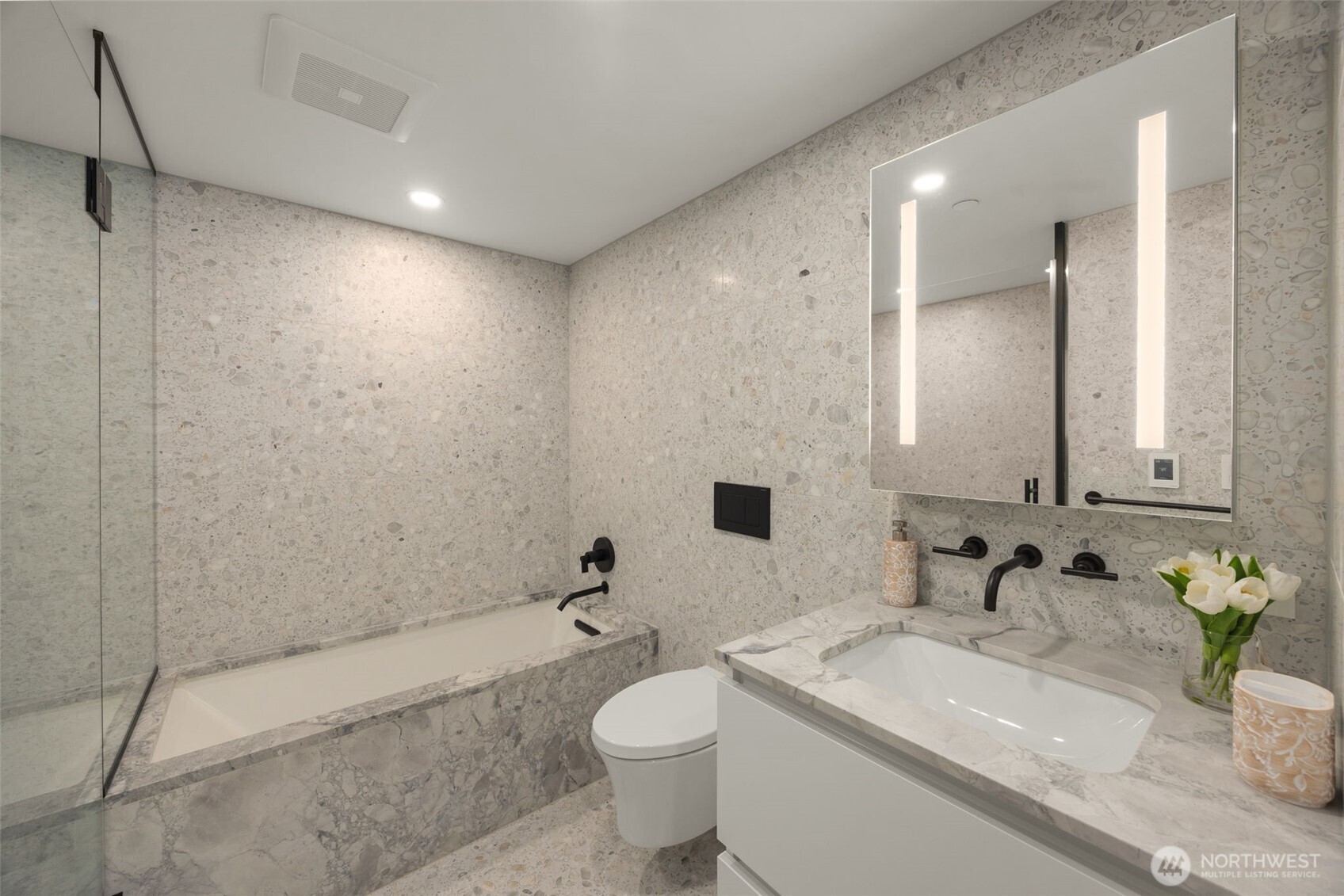 300 Virginia Street, Unit 3607 Seattle, WA 98101 - Photo 11 of 37 a bathroom with a sink a toilet and shower