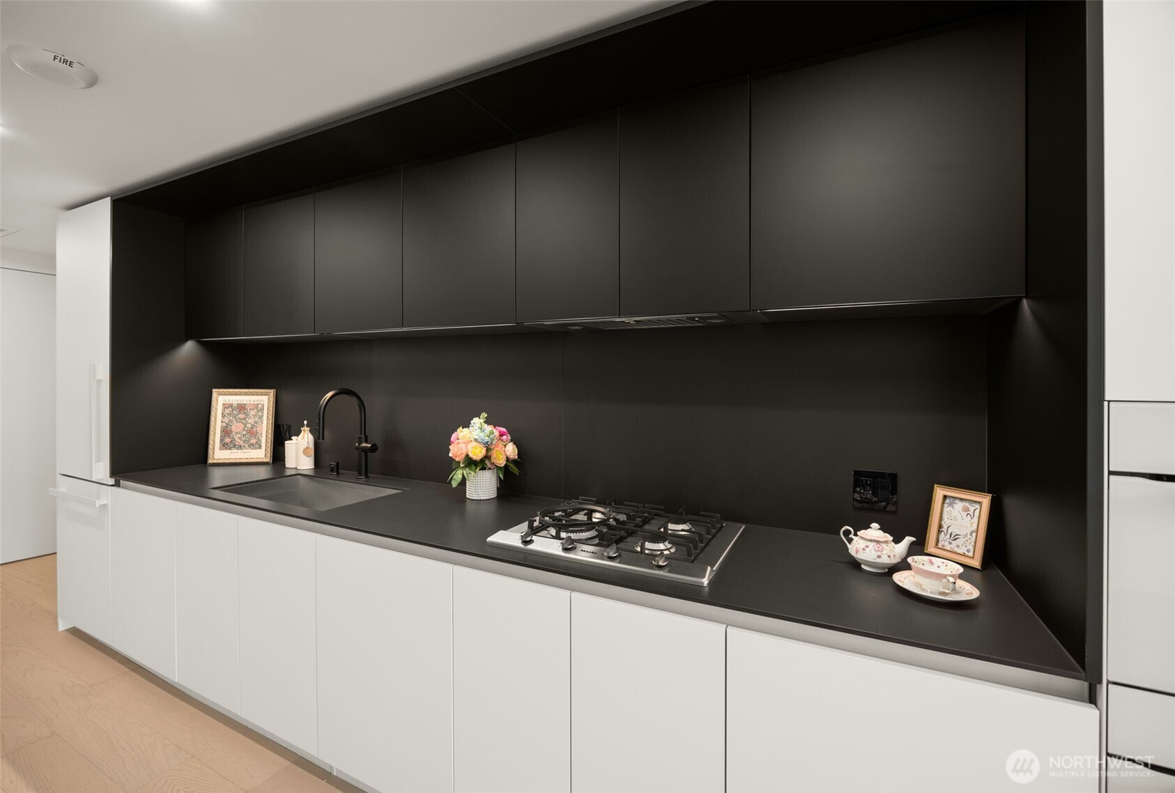 300 Virginia Street, Unit 3607 Seattle, WA 98101 - Photo 13 of 37 a kitchen with a sink and cabinets