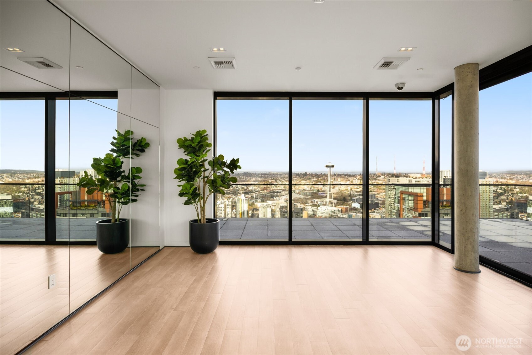 300 Virginia Street, Unit 3607 Seattle, WA 98101 - Photo 26 of 37 a view of workspace with large windows and palm tree